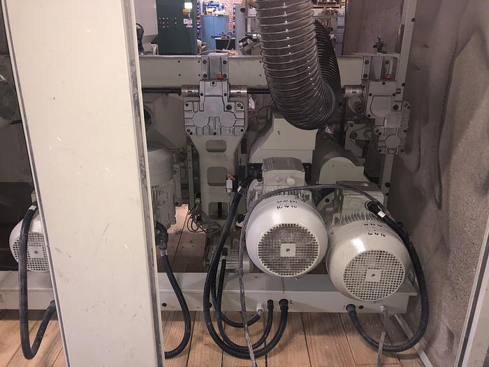 Used WEINIG UNIMAT-25E AUTOMATIC 5-SPINDLE FEED-THROUGH MOULDER