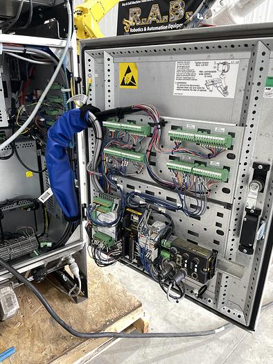 Used ABB IRB 2600-12/1.65 ROBOT WORK CELL CONSISTING OF 2 IRB 2600 ROBOTS RUNNING OFF OF 1 IRC5 CONTROLLER