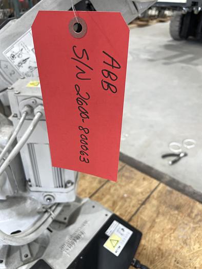 Used ABB IRB 2600-12/1.65 ROBOT WORK CELL CONSISTING OF 2 IRB 2600 ROBOTS RUNNING OFF OF 1 IRC5 CONTROLLER