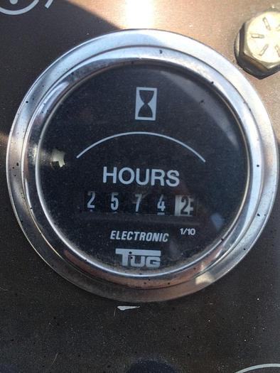 Used 1999 TUG MI60-13 baggage tow tractor. Power Steering. Zero-timed engine.