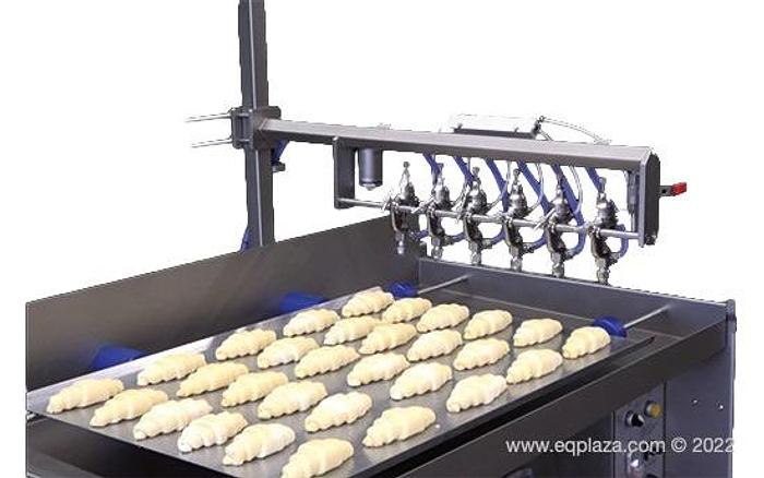 Обладнання для нанесення яєчного продукту з рухомим містком