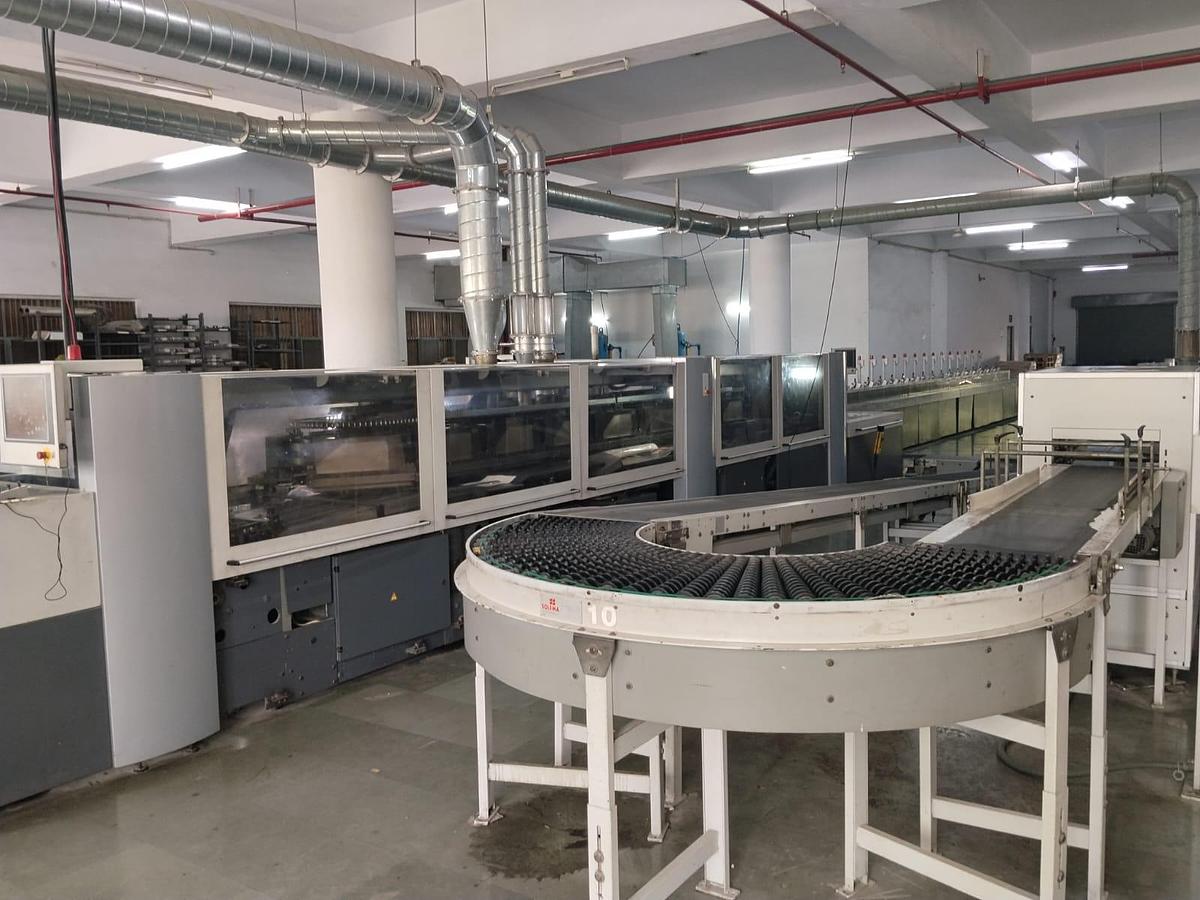 Used HEIDELBERG EUROBIND ET 4000C – Industrial Hotmelt Perfect Binding Machine, 4,000 Cycles/Hour, 18 Clamps, 16 Stations, 2–60 mm Book Block Thickness & 24 m Conveyor