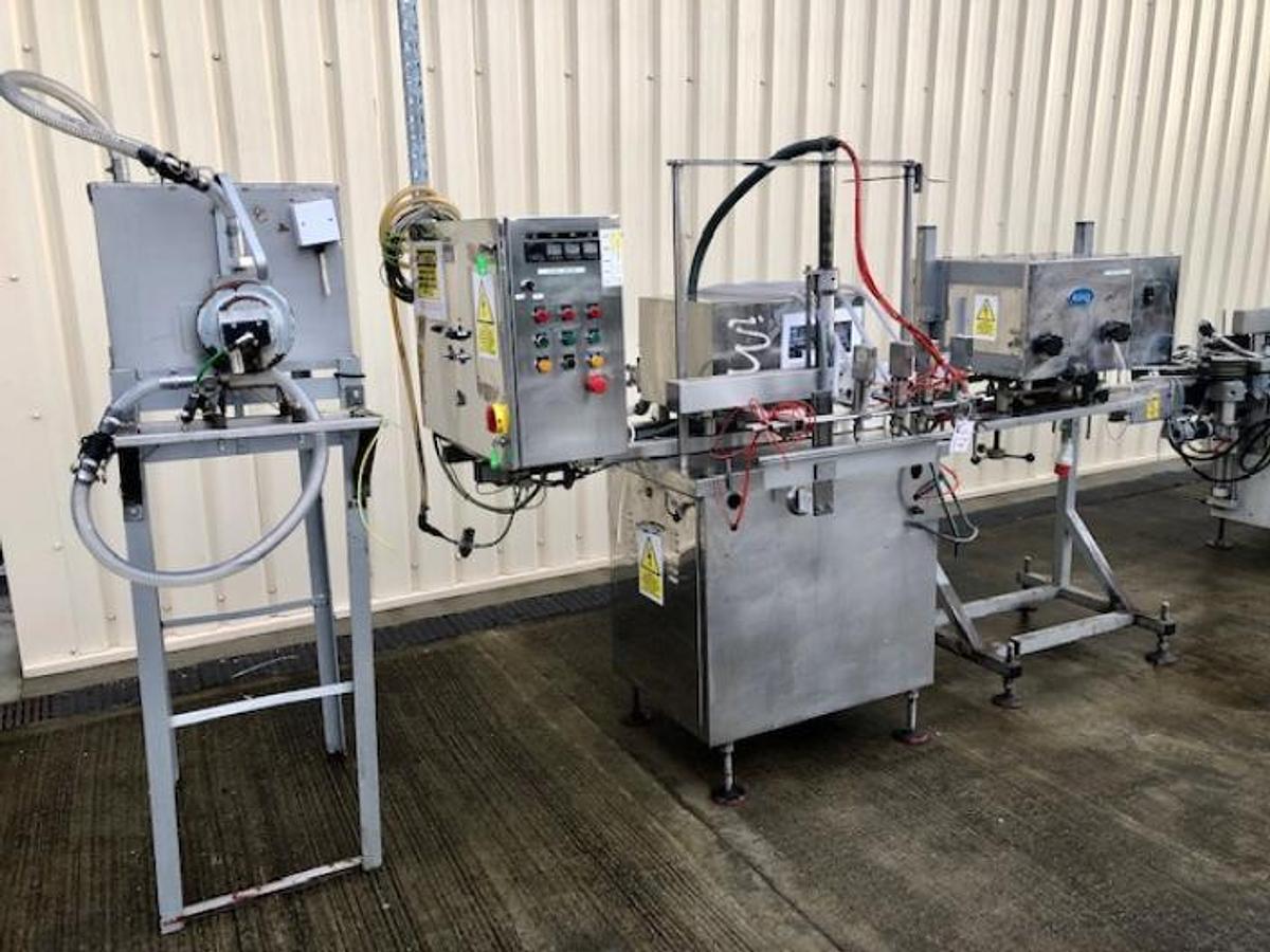 Used King 4 head liquid filling and capping line