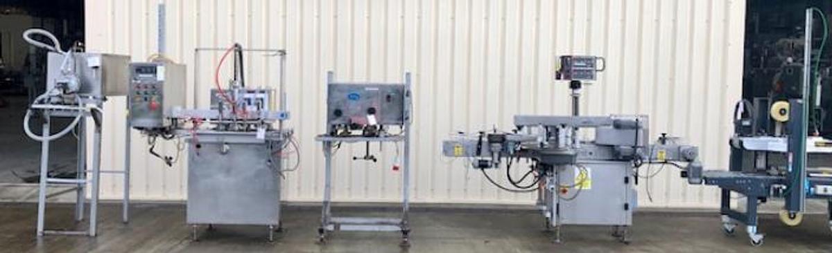 Used King 4 head liquid filling and capping line