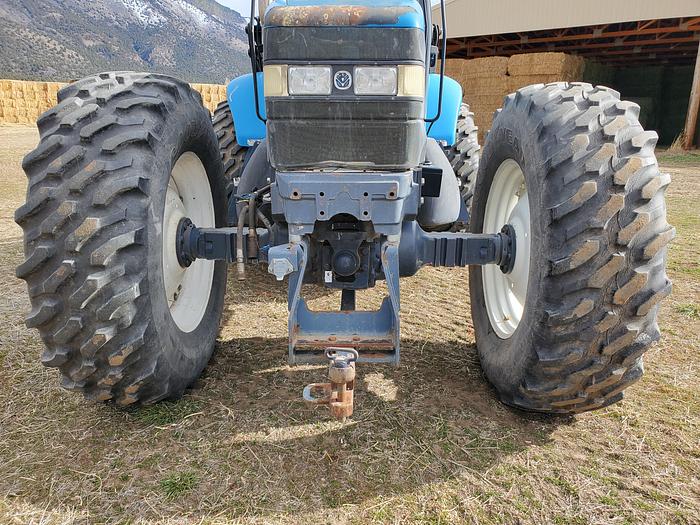 Used New Holland TV140 Bi-Directional Tractor