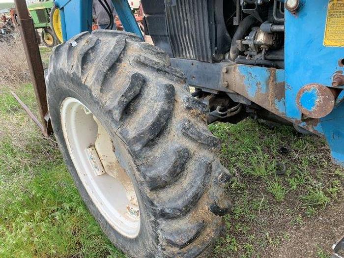 Used New Holland 7740 MFWD Tractor w/ loader