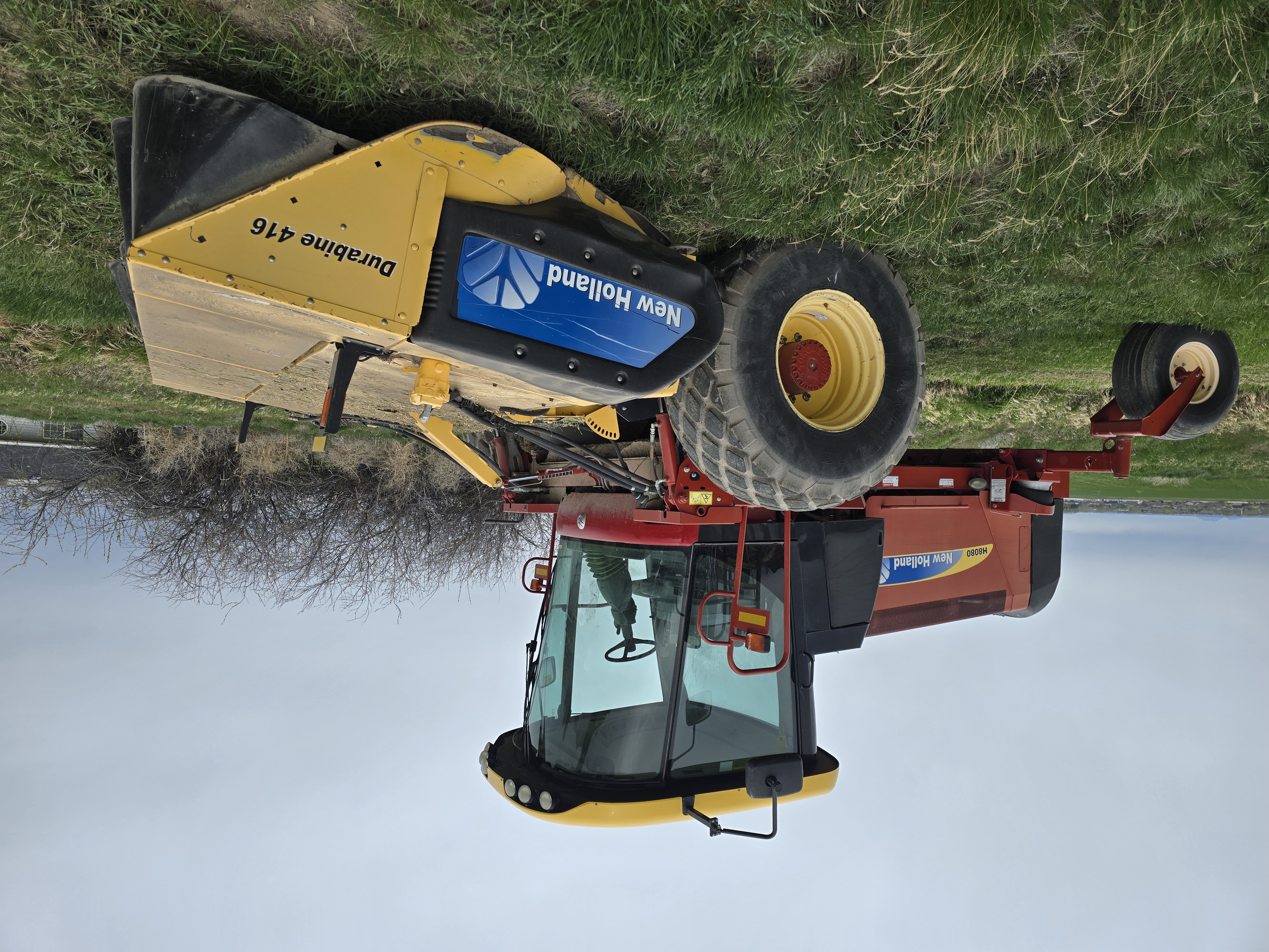 Used 16' New Holland H8080 Rotary Windrower w/ 730 hrs