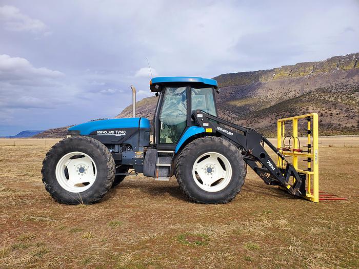 Used New Holland TV140 Bi-Directional Tractor