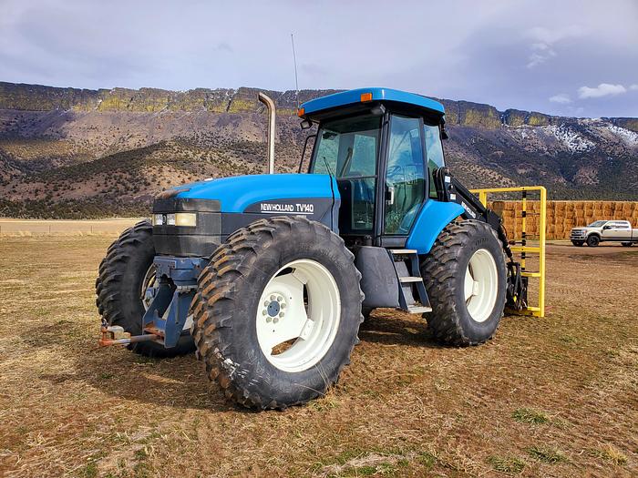 Used New Holland TV140 Bi-Directional Tractor