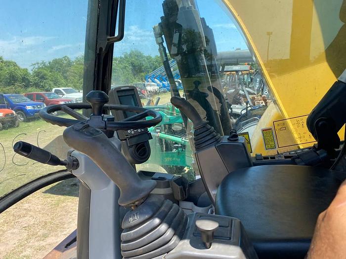 Used 1999 NEW HOLLAND 555E - BACKHOES