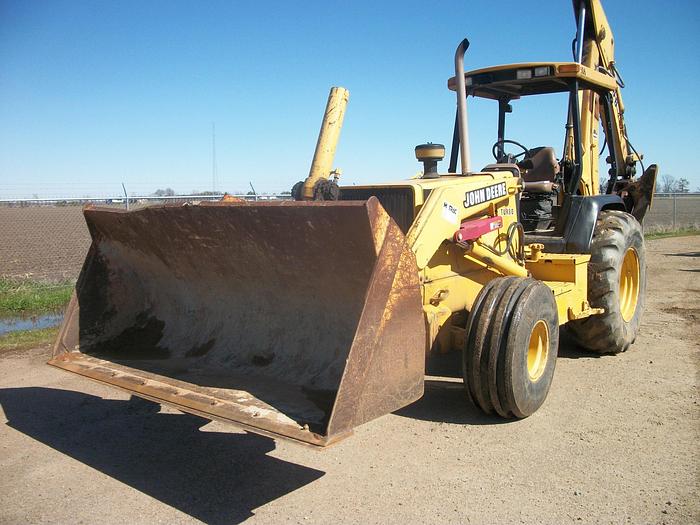Used 2000 JOHN DEERE 710D - BACKHOES