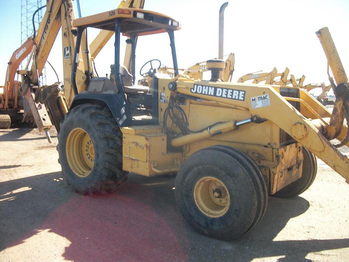 Used 2000 JOHN DEERE 710D - BACKHOES