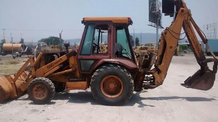 Used CATERPILLAR 580SK - BACKHOES