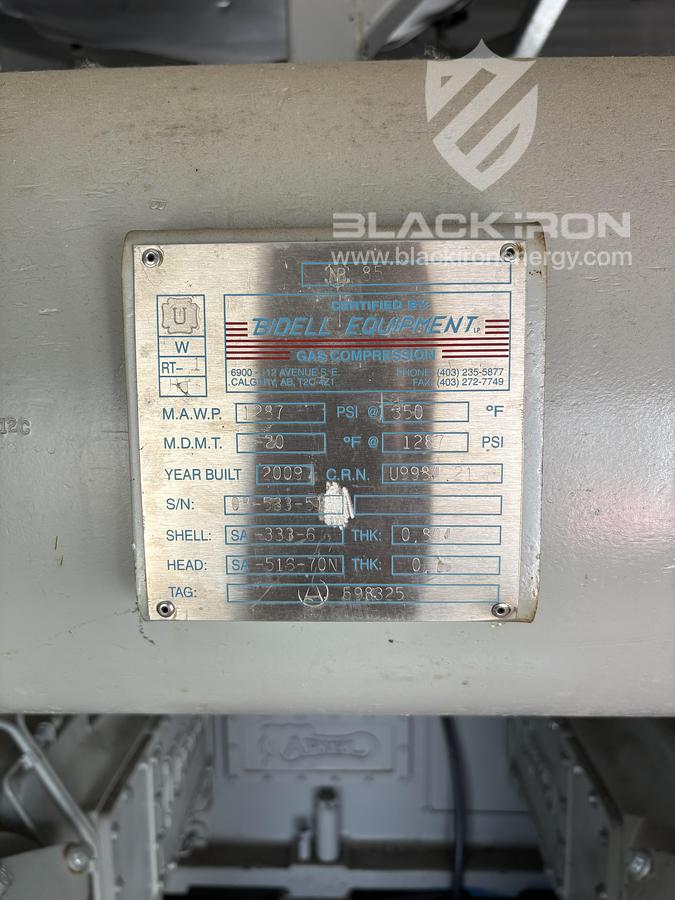 Used NOMAD Suction & Discharge Bottle