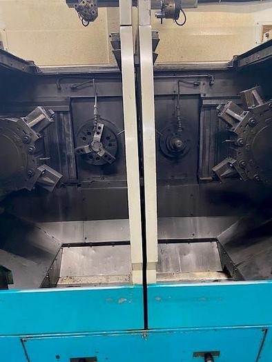 Used 2005 DOOSAN  QL300H twin CNC facing lathe - twin CNC center lathe