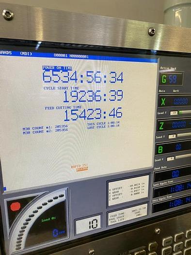 Used 2007 Haas CNC Lathe SL-10T & Servo Bar 300 Feeder