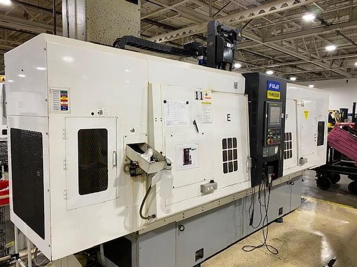 Used FUJI TNW 3500 TR TWIN SPINDLE TWIN TURRET CNC LATHES WITH GANTRY