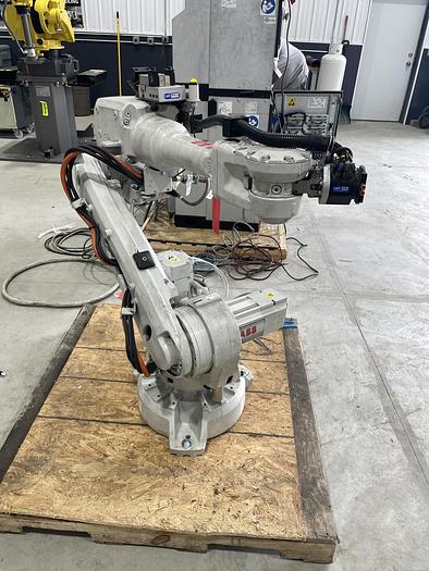Used ABB IRB 2600-12/1.65 ROBOT WORK CELL CONSISTING OF 2 IRB 2600 ROBOTS RUNNING OFF OF 1 IRC5 CONTROLLER