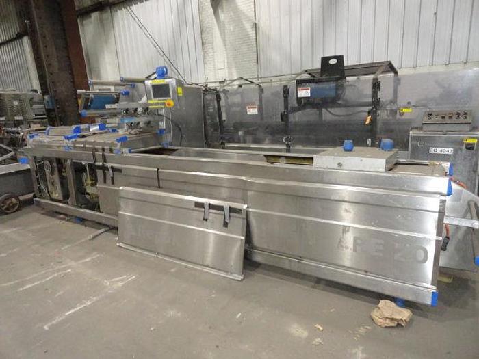 Used 2008 REPACK ROLLSTOCK PACKAGER, 18" WIDE BETWEEN CHAINS, 220 VOLT, BUILT 2008 RE-20