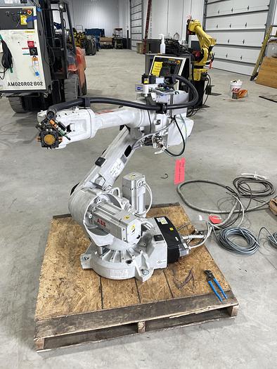 Used ABB IRB 2600-12/1.65 ROBOT WORK CELL CONSISTING OF 2 IRB 2600 ROBOTS RUNNING OFF OF 1 IRC5 CONTROLLER