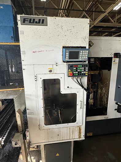 Used 2013 FUJI ANW 35 TWIN TURRET CNC LATHE, TAIL STOCK WITH ROBOT LOAD/UNLOAD AND STOCKER TABLES