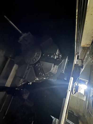 Used FUJI ANW 35 TWIN TURRET CNC LATHE, TAIL STOCK WITH ROBOT LOAD/UNLOAD AND STOCKER TABLES