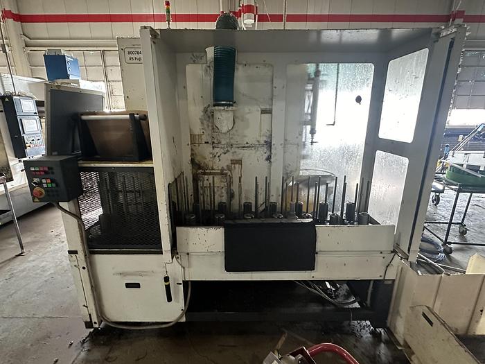 Used FUJI ANW 35 TWIN TURRET CNC LATHE, TAIL STOCK WITH ROBOT LOAD/UNLOAD AND STOCKER TABLES