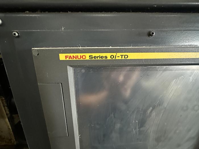 Used FUJI ANW 35 TWIN TURRET CNC LATHE, TAIL STOCK WITH ROBOT LOAD/UNLOAD AND STOCKER TABLES