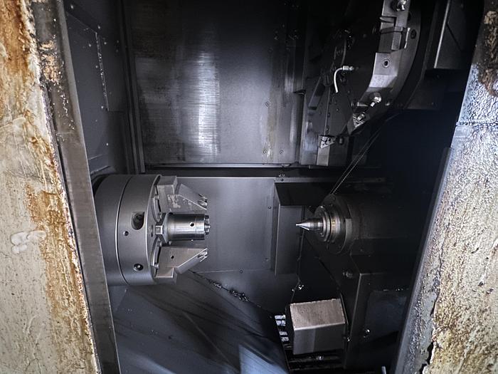 Used FUJI ANW 35 TWIN TURRET CNC LATHE, TAIL STOCK WITH ROBOT LOAD/UNLOAD AND STOCKER TABLES