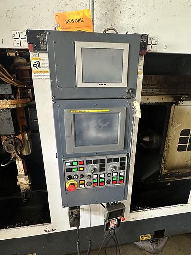 Used 2013 FUJI ANW 35 TWIN TURRET CNC LATHE, TAIL STOCK WITH ROBOT LOAD/UNLOAD AND STOCKER TABLES