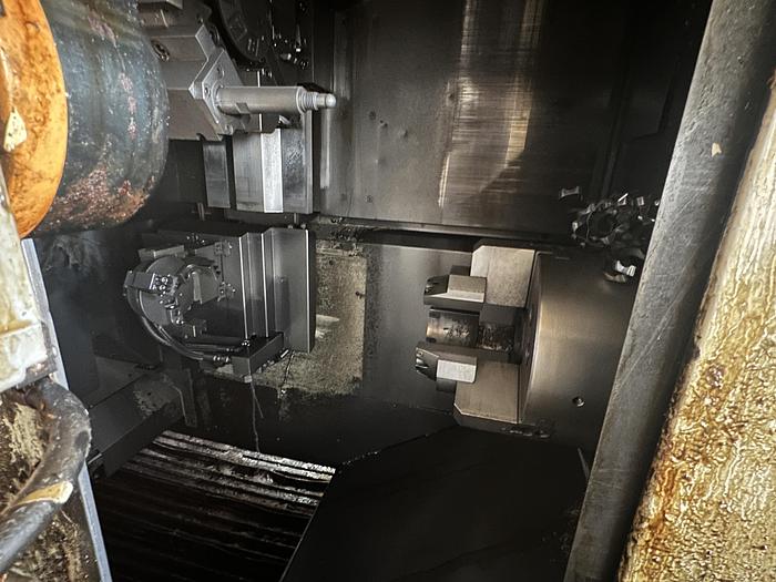 Used FUJI ANW 35 TWIN TURRET CNC LATHE, TAIL STOCK WITH ROBOT LOAD/UNLOAD AND STOCKER TABLES