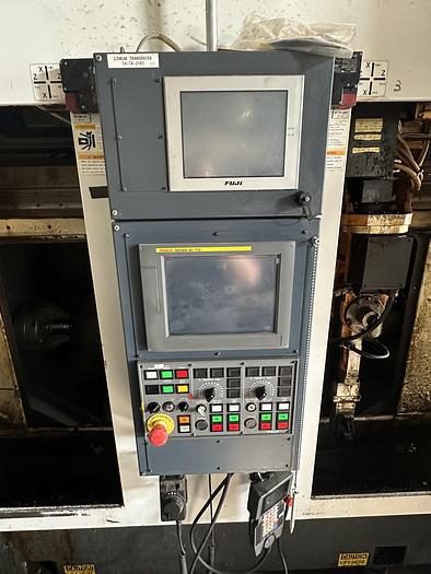 Used FUJI ANW 35 TWIN TURRET CNC LATHE, TAIL STOCK WITH ROBOT LOAD/UNLOAD AND STOCKER TABLES