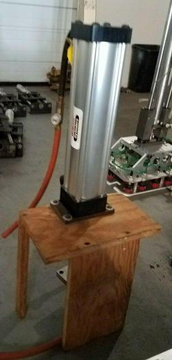 Used Schrader Bellows Eco Ram II Cylinder mounted on platform