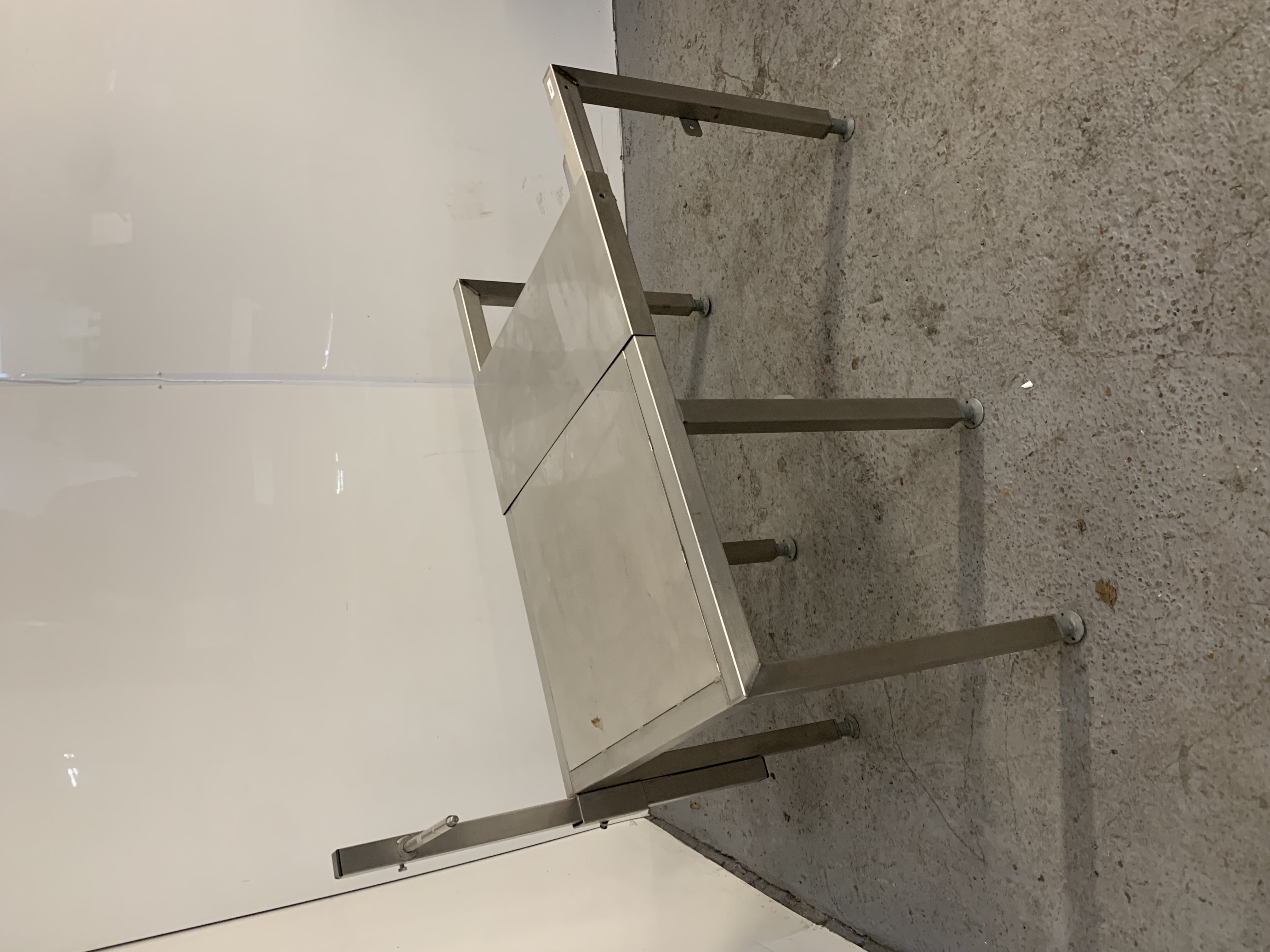Used Used Stainless Steel Table with Sliding Top.