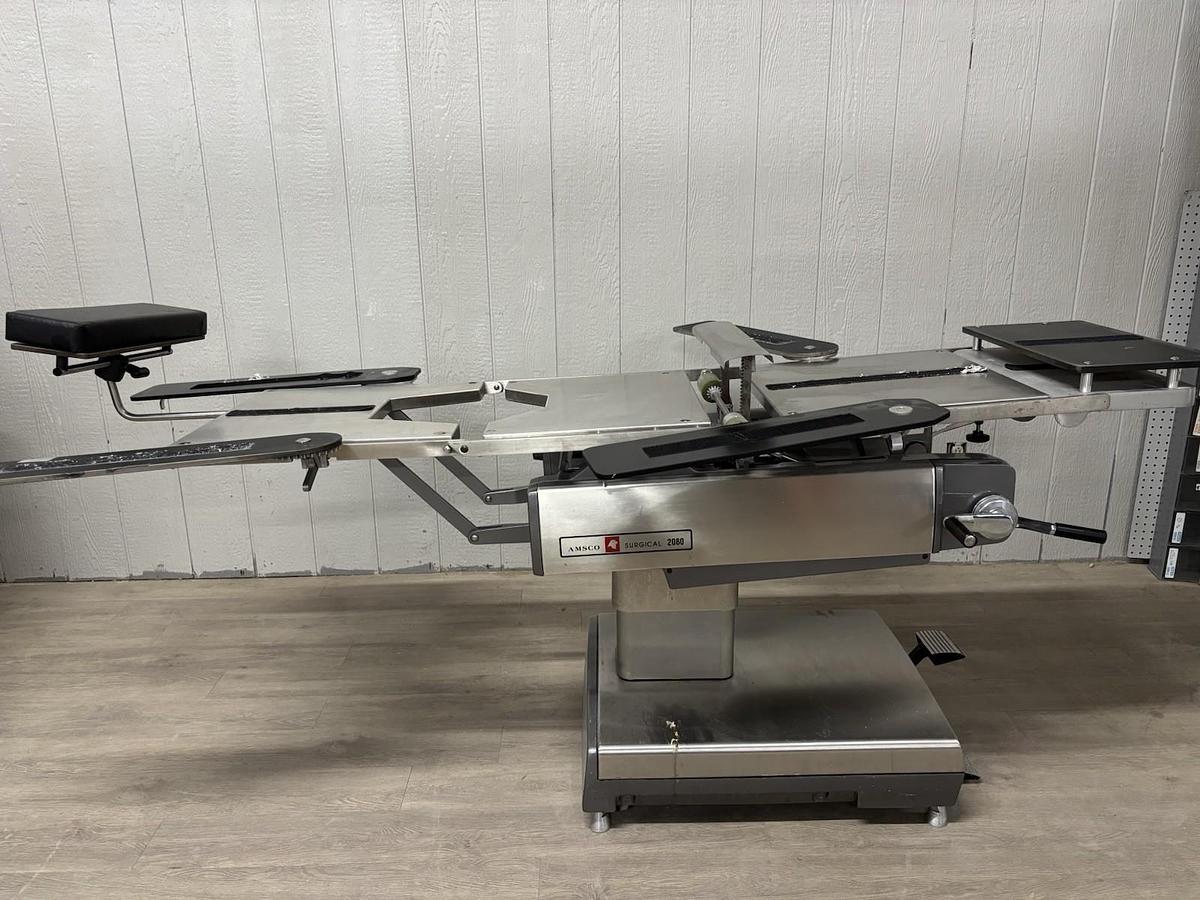 Used AMSCO 2080 manual surgical table And Pads And Attachments