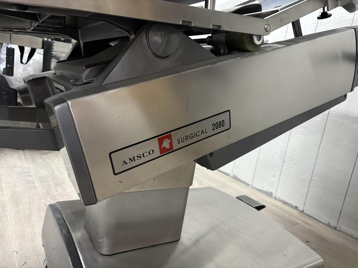 Used AMSCO 2080 manual surgical table And Pads And Attachments