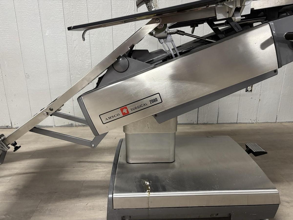Used AMSCO 2080 manual surgical table And Pads And Attachments