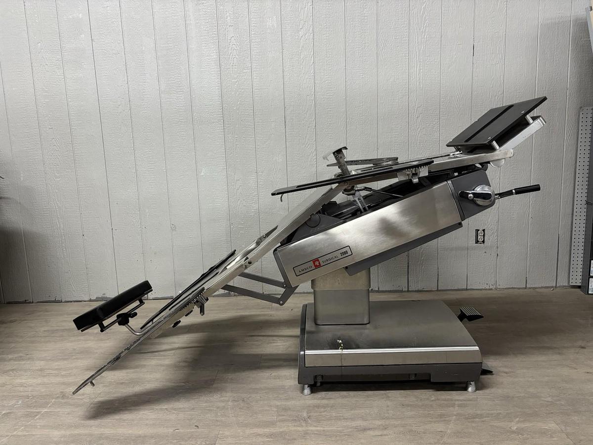 Used AMSCO 2080 manual surgical table And Pads And Attachments