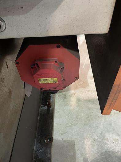 Used FANUC ARCMATE 120iC/10L MIG WELDING CELL WITH 2 AXIS 10' LONG DROP CENTER TRUNNION W/ROTARY CNC TABLE