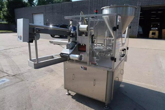 Used Orics R50 Rotary Cup filling, Sealing and Lid Applying Line