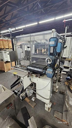 Used Hartness Lowering Head Case Packer