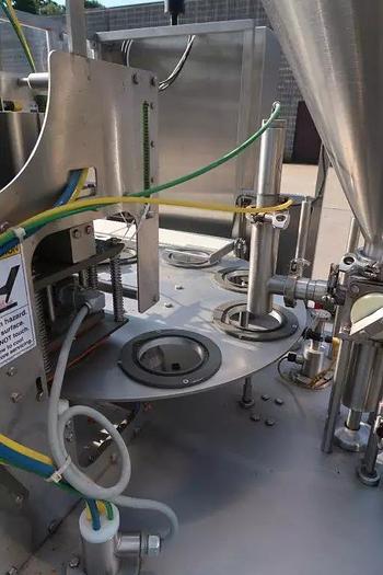 Used Orics R50 Rotary Cup filling, Sealing and Lid Applying Line