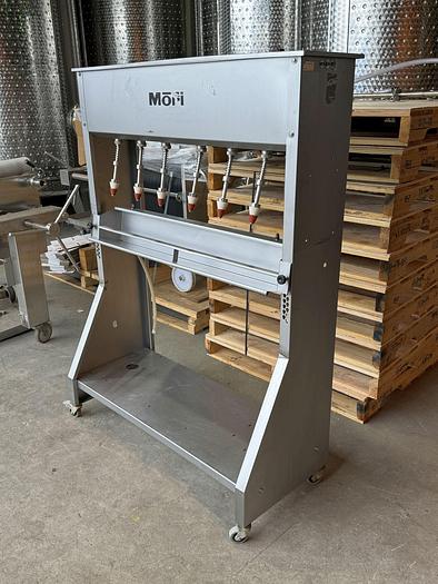 Used Used Mori 6 spout gravity filler