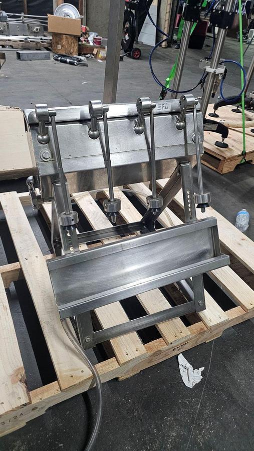 Used Used-GAI 4 Head Table Top Manual Gravity filler
