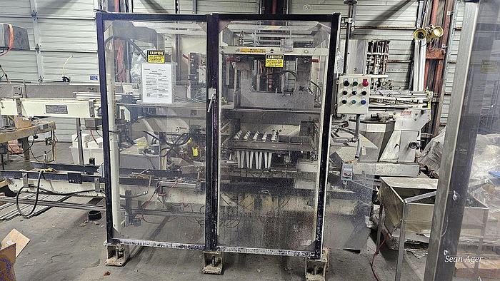 Used Hartness Lowering Head Case Packer