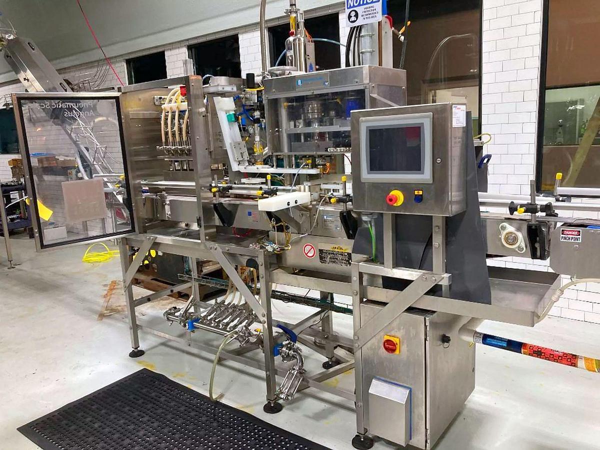 Used Used Pneumatic Scale/Angelus CB50F 6 head can filler/seamer