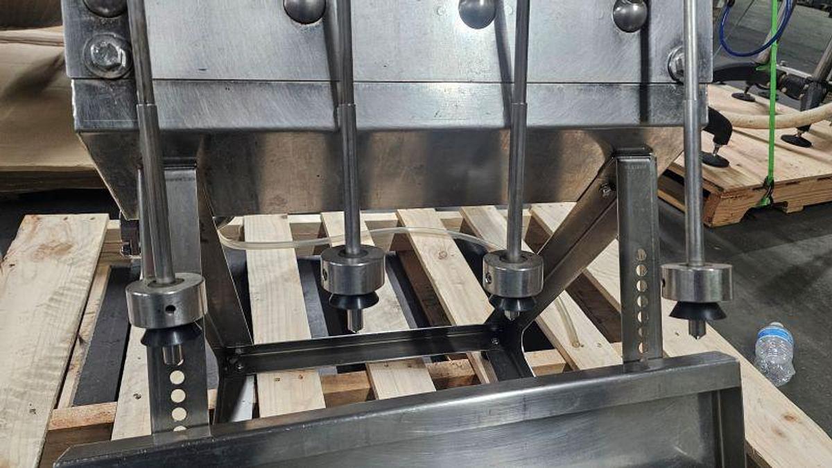 Used Used-GAI 4 Head Table Top Manual Gravity filler