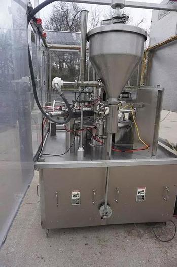 Used Modern Packaging MR Series Rotary cup Filling and Sealing Filling line