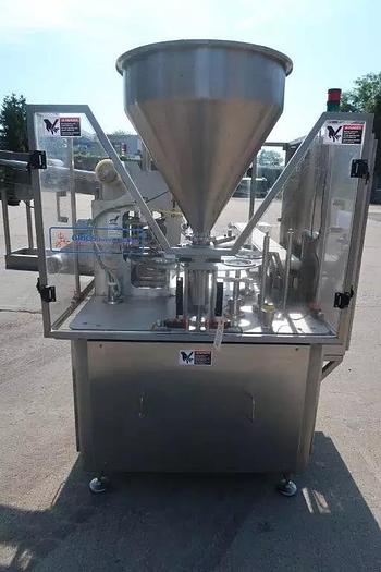 Used Orics R50 Rotary Cup filling, Sealing and Lid Applying Line