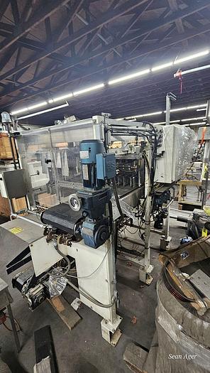 Used Hartness Lowering Head Case Packer